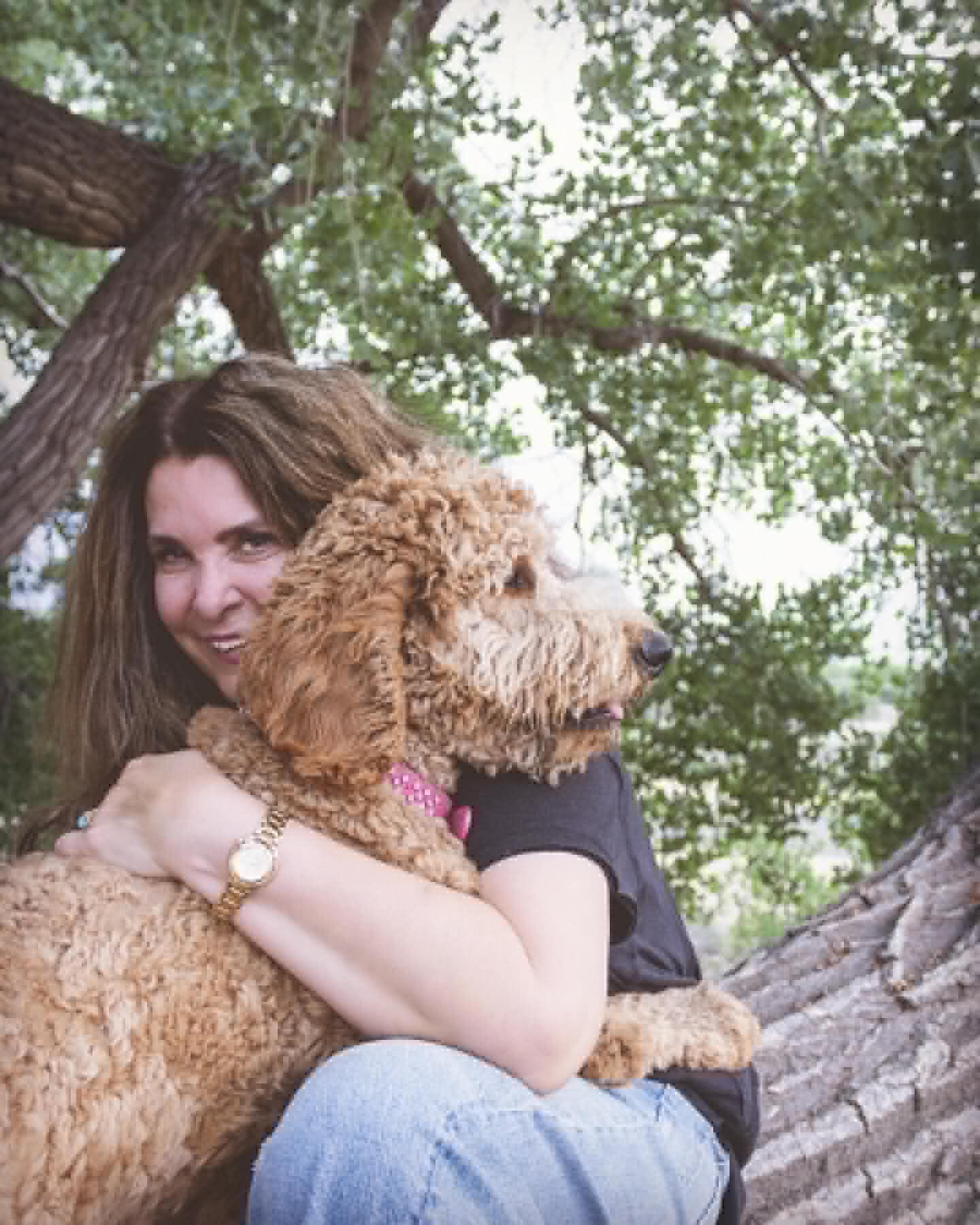 Janet Hensley with a goldendoodle